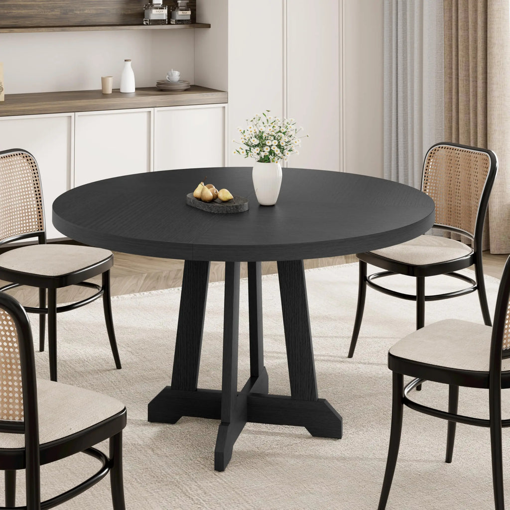 Table à manger ronde Noria 120 cm — plateau bois teinté noir et piètement central en X – finition noir