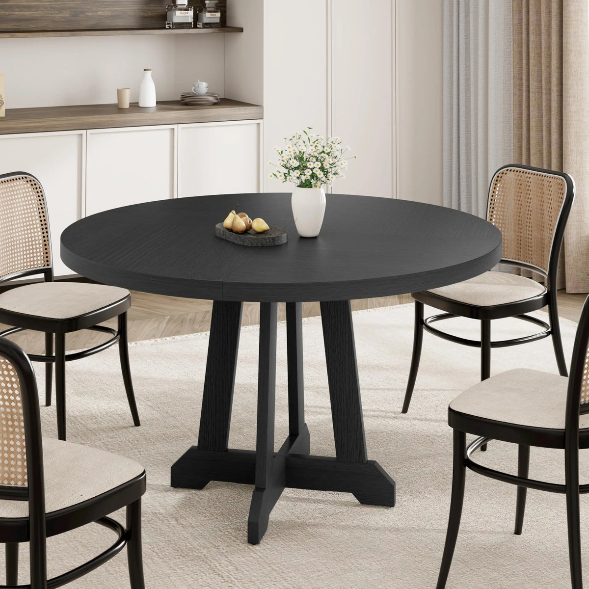 Table à manger ronde Noria 120 cm — plateau bois teinté noir et piètement central en X – finition noir