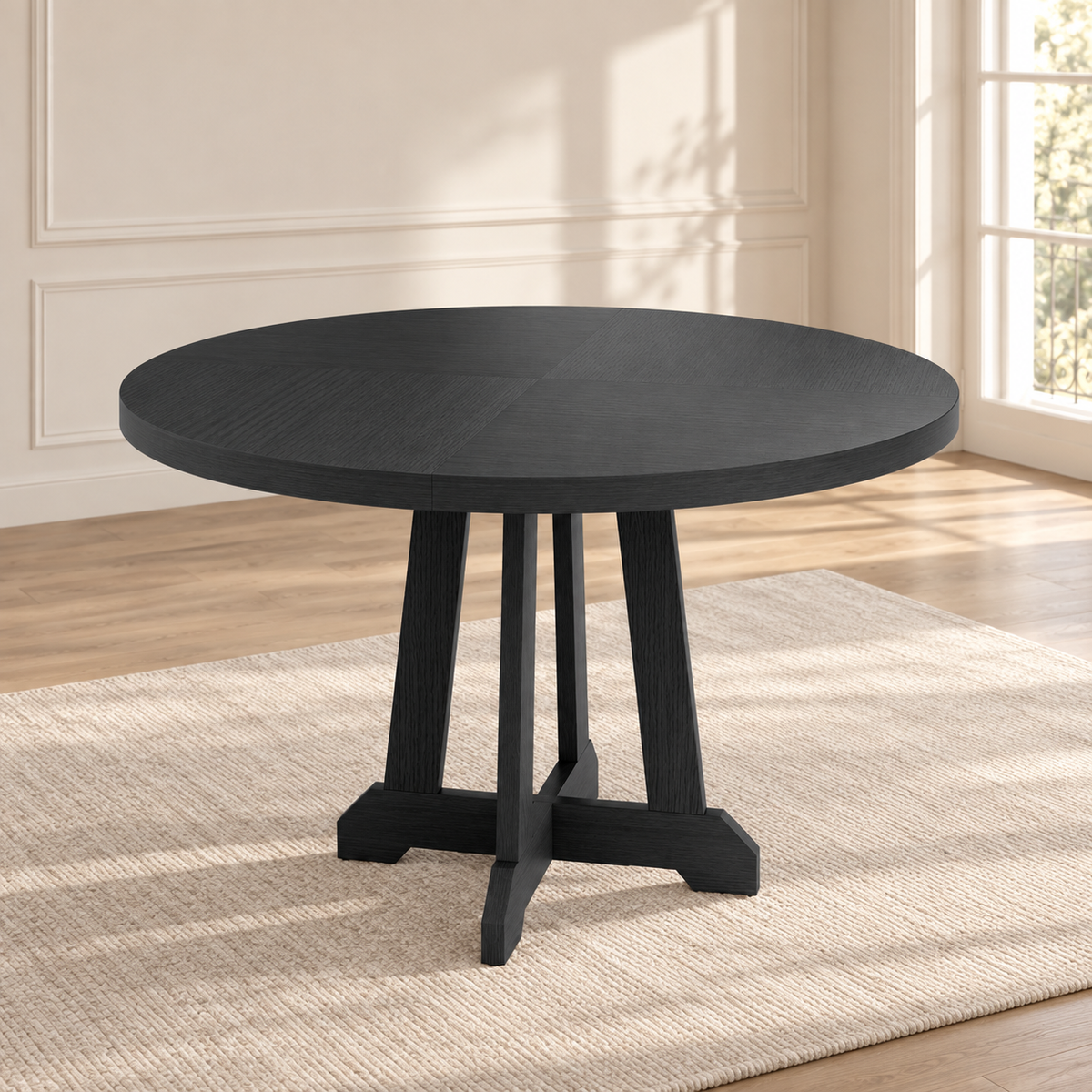 Table à manger ronde Noria 120 cm — plateau noir et pied central en X — produit seul dans un intérieur de maison