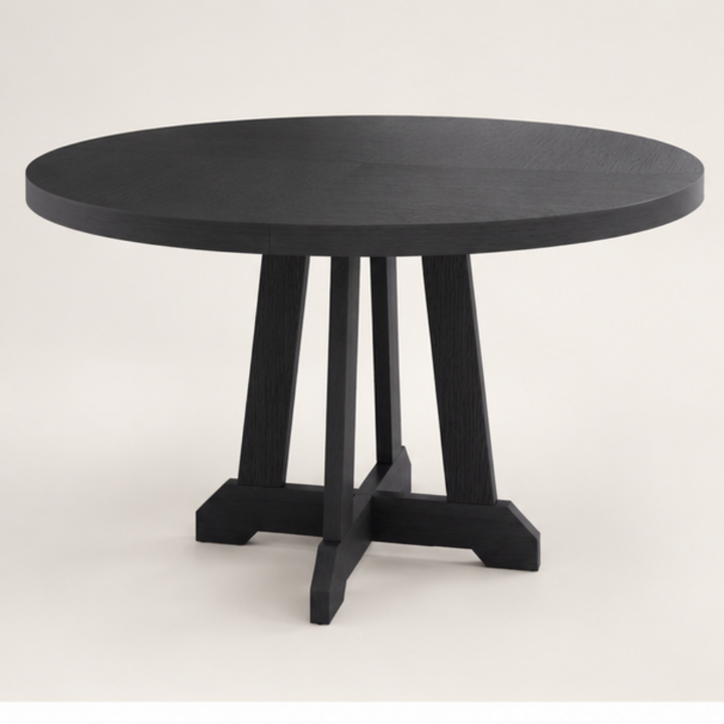Table à manger ronde Noria 120 cm — plateau bois teinté noir et piètement central en X – vue trois-quarts sur fond blanc cassé