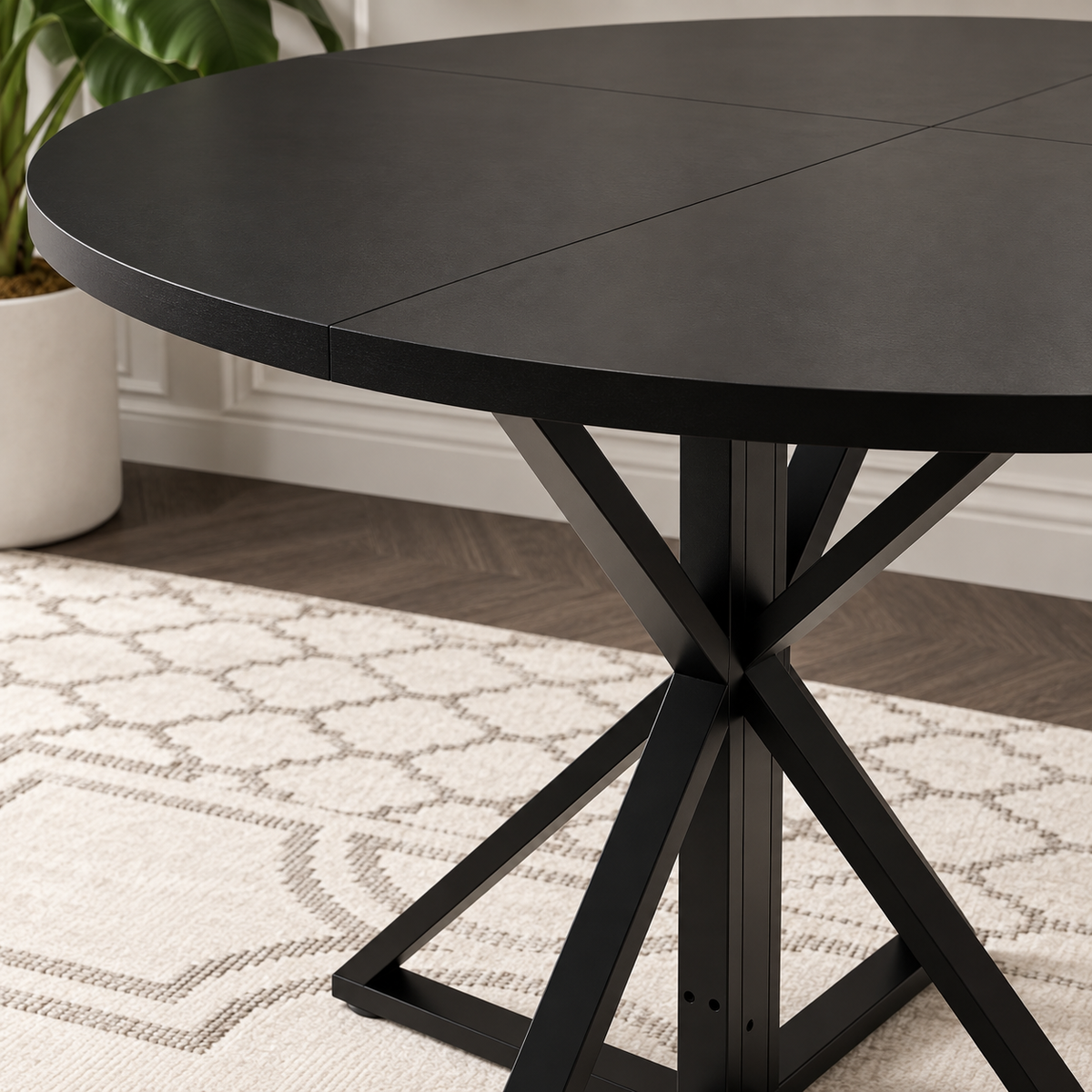 Table à manger ronde Araignée 120 cm — plateau noir et piètement métal croisé – détail de la finition